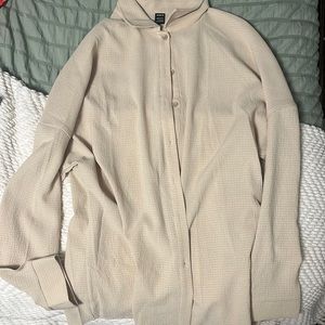 white and tan flowy button ups